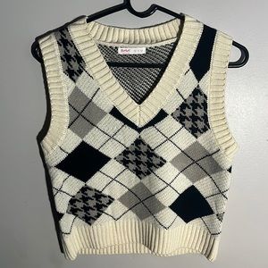 White, black, cream vest.